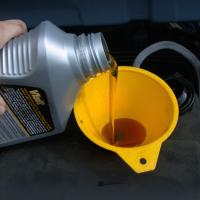 Motor_oil_refill_with_funnel Resized.jpg